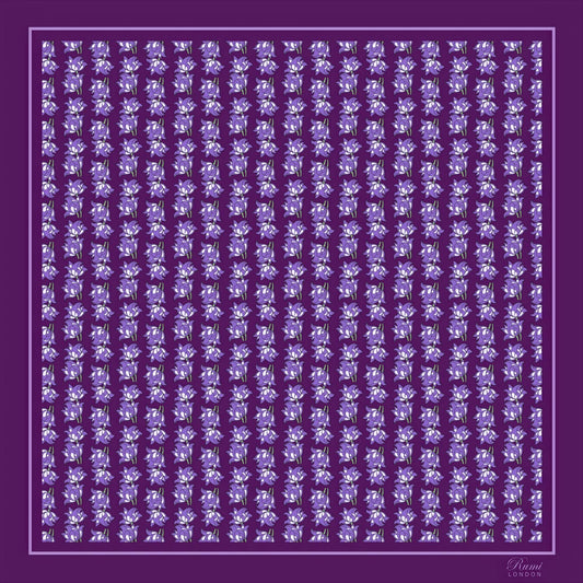 Purple silk twill scarf with small floral motifs in repeat pattern on a purple background.