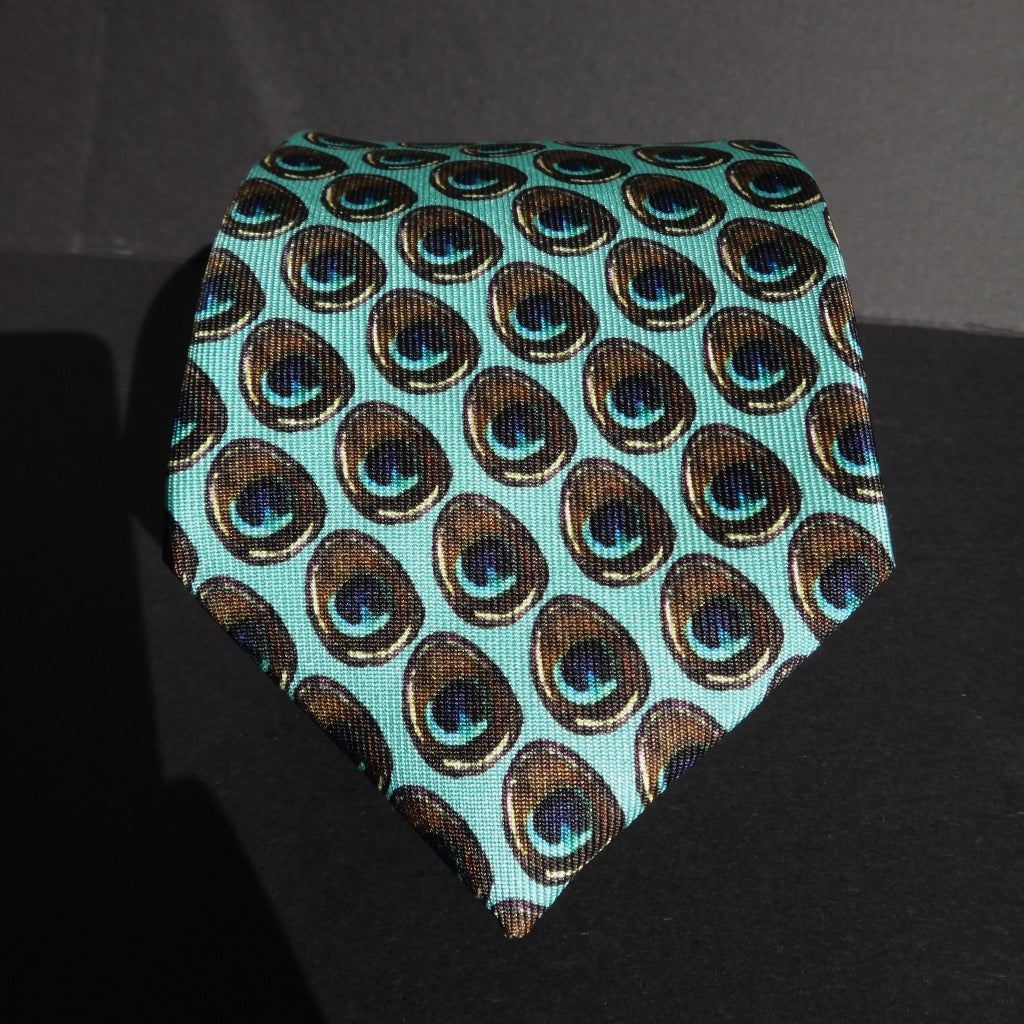 Pure Silk Peacock Feather Motif Tie rolled to accentuate the tip of the tie.