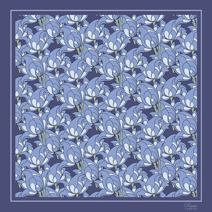 Square silk scarf with blue florals on a blue background and border with 'Rumi London' branding in a corner.
