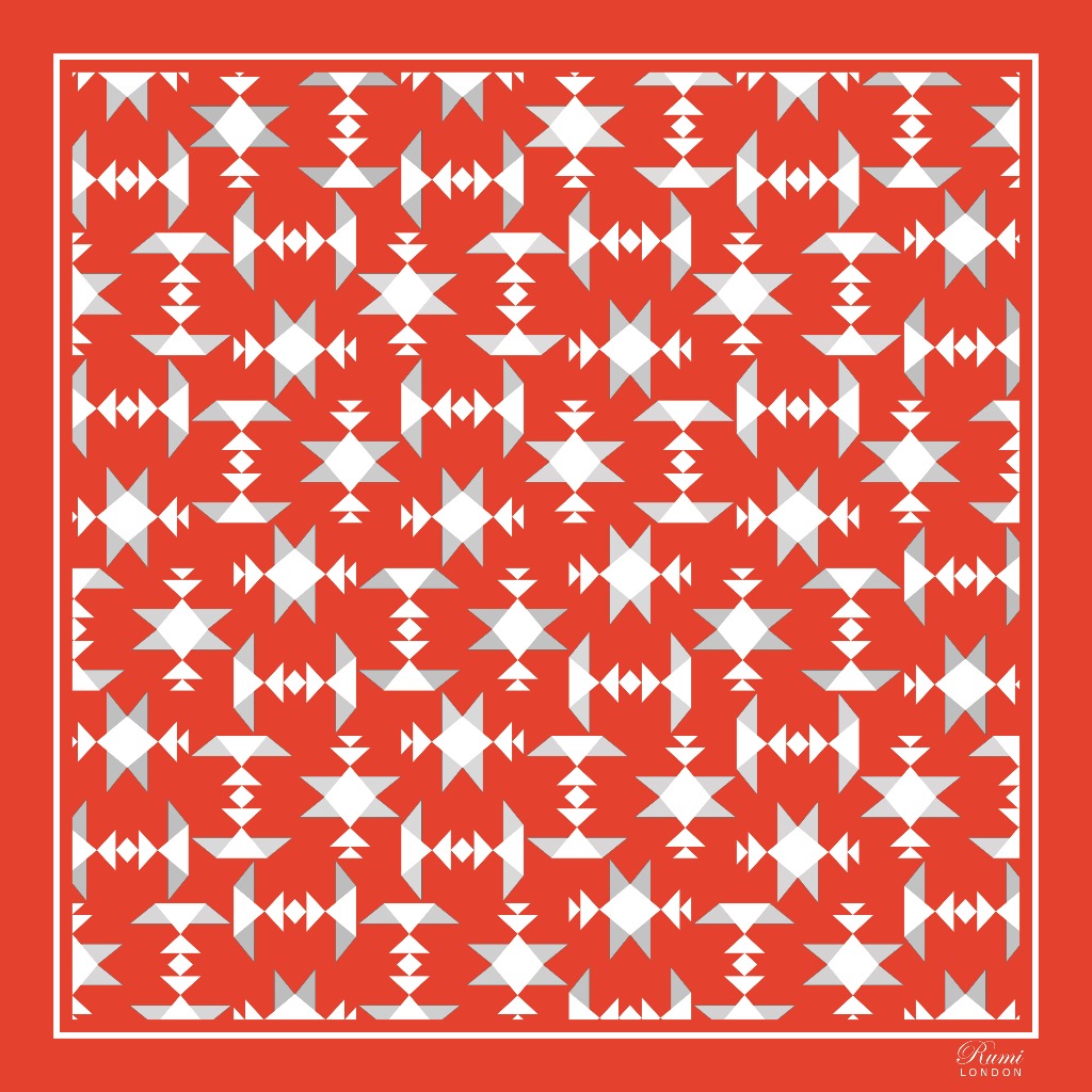 Square silk scarf with white geometric pattern on an orange background and border.